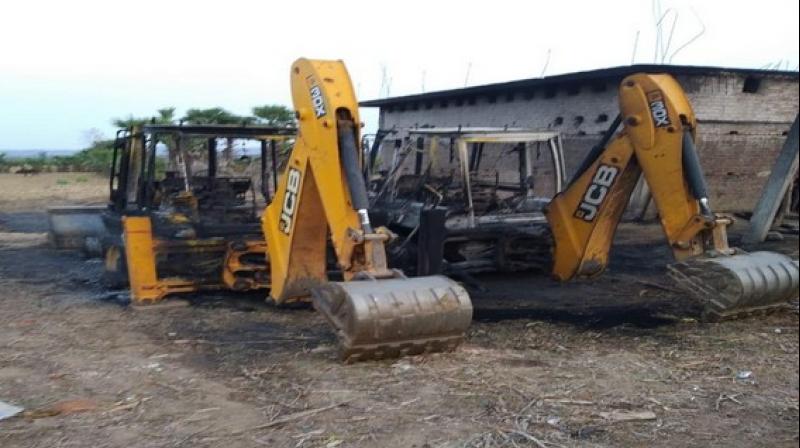 Construction vehicles torched by naxals in Bihar's Gaya. (Photo: ANI) Construction vehicles torched by naxals in Bihar's Gaya. (Photo: ANI)