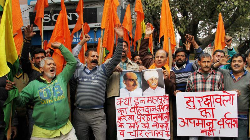 Activists of Shiv Sena shout slogans to protest against the decision to grant ex-gratia relief compensation of Rs 4 Lakhs and job to the family of Burhan Wani. (Photo: PTI/File) Activists of Shiv Sena shout slogans to protest against the decision to grant ex-gratia relief compensation of Rs 4 Lakhs and job to the family of Burhan Wani. (Photo: PTI/File)