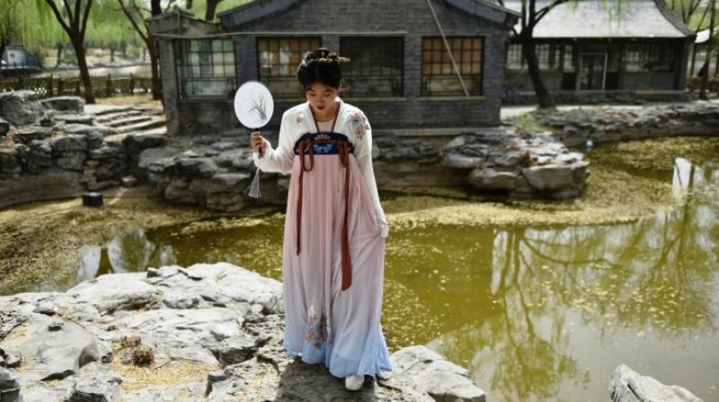 These historic costumes of the Han ethnic majority are enjoying a renaissance in part because the government is promoting traditional culture in a bid to boost patriotism and national identity. (Photo: AFP) These historic costumes of the Han ethnic majority are enjoying a renaissance in part because the government is promoting traditional culture in a bid to boost patriotism and national identity. (Photo: AFP)