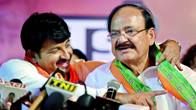 Union Minister M. Venkaiah Naidu and Delhi BJP chief Manoj Tiwari after their victory in the MCD polls. (Photo: PTI) Union Minister M. Venkaiah Naidu and Delhi BJP chief Manoj Tiwari after their victory in the MCD polls. (Photo: PTI)