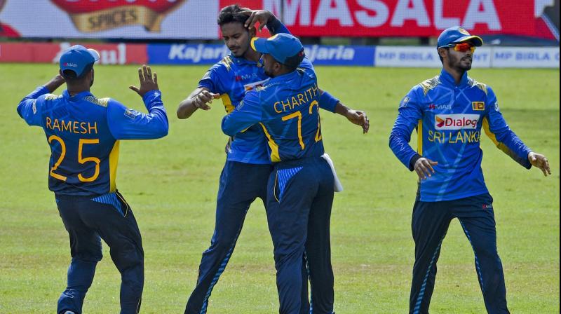 Dushmantha Chameera celebrates with his teammates after taking a wicket in this file picture. (Photo: AFP)