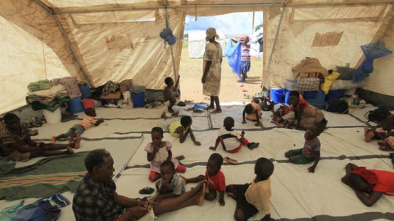 Children sit inside a tent at a camp set up for flood victims in Tsholostho about 200 kilometres north of Bulawayo, Saturday, March 4, 2017. (Photo: AP) Children sit inside a tent at a camp set up for flood victims in Tsholostho about 200 kilometres north of Bulawayo, Saturday, March 4, 2017. (Photo: AP)