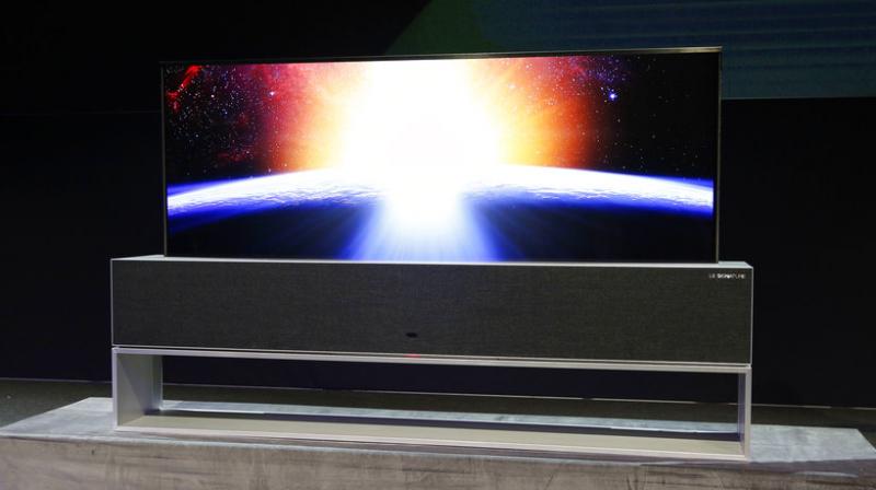 The set can still play music when the screen is rolled down completely, or display a clock when it's just partially rolled down. LG says the TV will be available later this year. The set can still play music when the screen is rolled down completely, or display a clock when it's just partially rolled down. LG says the TV will be available later this year.