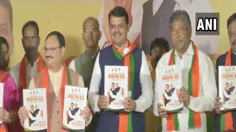 BJP Working President J P Nadda and Maharashtra CM Devendra Fadnavis releasing part manifesto. (Photo: ANI) BJP Working President J P Nadda and Maharashtra CM Devendra Fadnavis releasing part manifesto. (Photo: ANI)