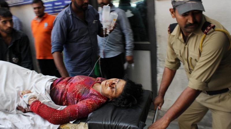 A security personnel taking a civilian to a GMC hospital in Jammu after she was injured in cross-border firing by Pakistan. (Photo: PTI) A security personnel taking a civilian to a GMC hospital in Jammu after she was injured in cross-border firing by Pakistan. (Photo: PTI)