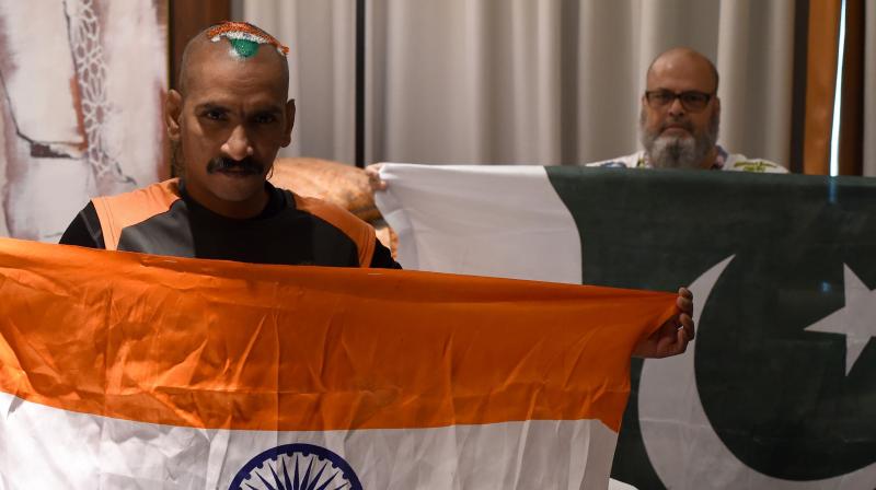 Their governments might not be ready for talks, but that did not stop Pakistan's Mohammad Basheer opening his heart, and his wallet, to ensure India's most recognised cricket fan Sudhir Chaudhary, also known as Sudhir Kumar Gautam, could be at the Asia Cup. (Photo: AFP) Their governments might not be ready for talks, but that did not stop Pakistan's Mohammad Basheer opening his heart, and his wallet, to ensure India's most recognised cricket fan Sudhir Chaudhary, also known as Sudhir Kumar Gautam, could be at the Asia Cup. (Photo: AFP)