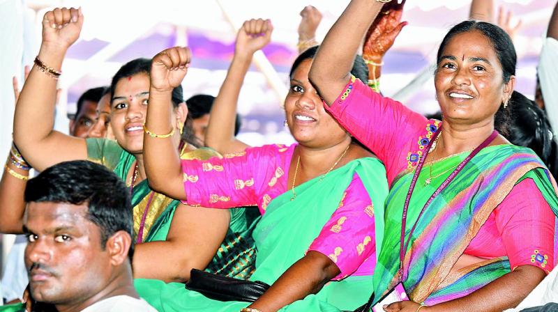 Participants are all smiles as CM Chandrasekhar Rao distributes cheque and pattadar passbooks to farmers in Raithu Bandapathakamat Dharmarajupalli in Huzurabad mandal, Karimnagar district, on Thursday. (Photo: DC) Participants are all smiles as CM Chandrasekhar Rao distributes cheque and pattadar passbooks to farmers in Raithu Bandapathakamat Dharmarajupalli in Huzurabad mandal, Karimnagar district, on Thursday. (Photo: DC)