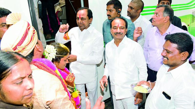 Chief Minister K. Chandrasekhar Rao blesses the newly-wedded couple of Kavya and Manohar at Thadikal Shankarpattanam mandal in Karimnagar district on Thursday. (Photo: DECCAN CHRONICLE) Chief Minister K. Chandrasekhar Rao blesses the newly-wedded couple of Kavya and Manohar at Thadikal Shankarpattanam mandal in Karimnagar district on Thursday. (Photo: DECCAN CHRONICLE)