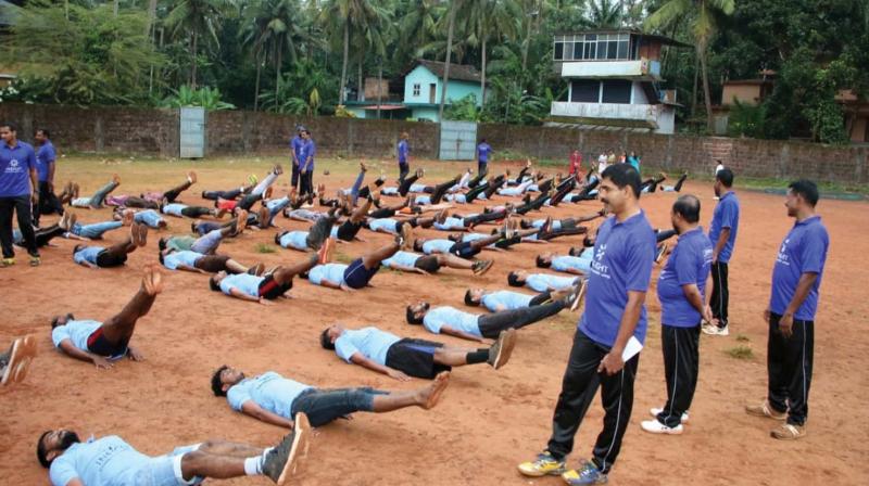 Students undergo physical training lessons at Panoor government higher secondary school ground in Panoor. Students undergo physical training lessons at Panoor government higher secondary school ground in Panoor.