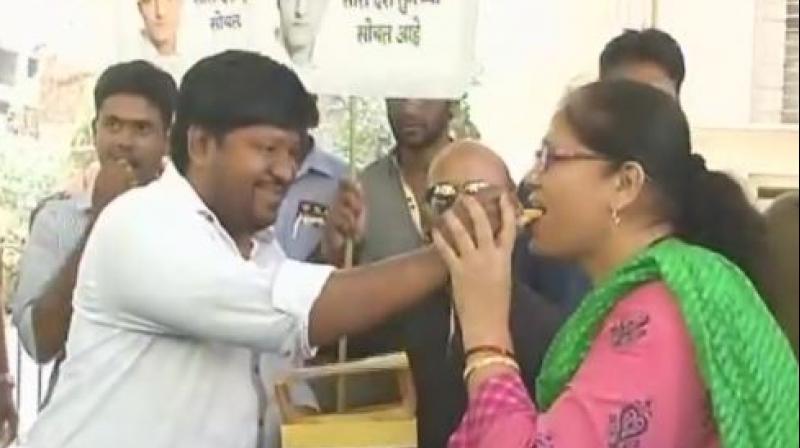 Several workers of a political party also joined locals in the celebrations outside Jadhav's apartment by bursting crackers and distributing sweets. (Photo: Twitter | ANI) Several workers of a political party also joined locals in the celebrations outside Jadhav's apartment by bursting crackers and distributing sweets. (Photo: Twitter | ANI)