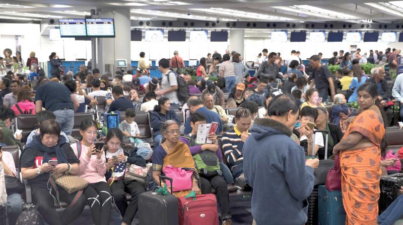 Passengers stranded at the Hong Kong International airport on Monday (Photo: AFP) Passengers stranded at the Hong Kong International airport on Monday (Photo: AFP)