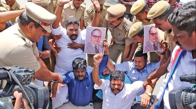 Outside the district collectrate here, members of the VCK arrested for protesting against caste fanatics who were involved in vandalising Dr. Ambedkar's statue in Vedaranyam. (Photo: DC) Outside the district collectrate here, members of the VCK arrested for protesting against caste fanatics who were involved in vandalising Dr. Ambedkar's statue in Vedaranyam. (Photo: DC)