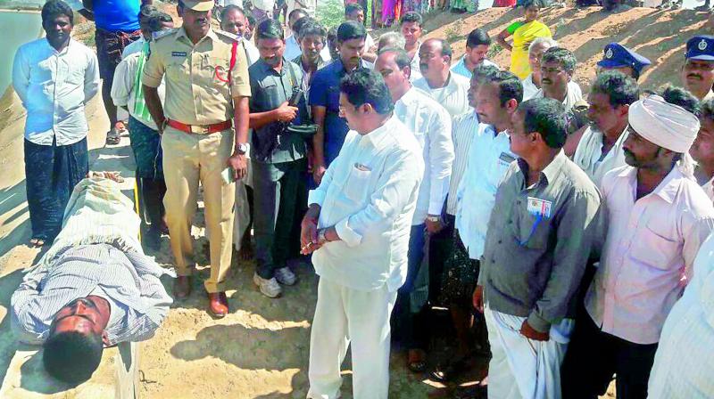 The people of Amudalapalli and Achutapuram block the Nizampatnam-Bapatla main road demanding closure of a marine storage and processing unit alleging contamination of drinking water at Amudalapalli in Guntur district on Friday. (Photo: DC) The people of Amudalapalli and Achutapuram block the Nizampatnam-Bapatla main road demanding closure of a marine storage and processing unit alleging contamination of drinking water at Amudalapalli in Guntur district on Friday. (Photo: DC)