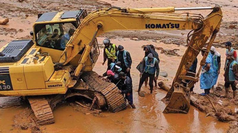 Wayanad sub-collector N.S.K Umesh and his team during rescue operations in Puthumala. (DC) Wayanad sub-collector N.S.K Umesh and his team during rescue operations in Puthumala. (DC)