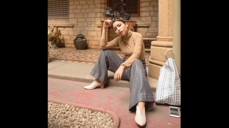 Sonia Thiyam, a fashion blogger wearing checked pants, which was a top trend in 2017 Sonia Thiyam, a fashion blogger wearing checked pants, which was a top trend in 2017