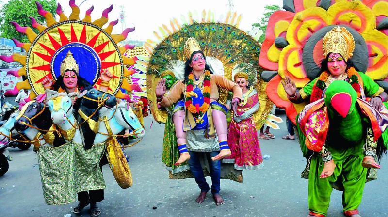 Eluru-based folk artistes perform during the annual festival of local Goddess Kanakadurga Ammavaru at Isukathota junction in Visakhapatnam on Tuesday.(Photo: DC) Eluru-based folk artistes perform during the annual festival of local Goddess Kanakadurga Ammavaru at Isukathota junction in Visakhapatnam on Tuesday.(Photo: DC)
