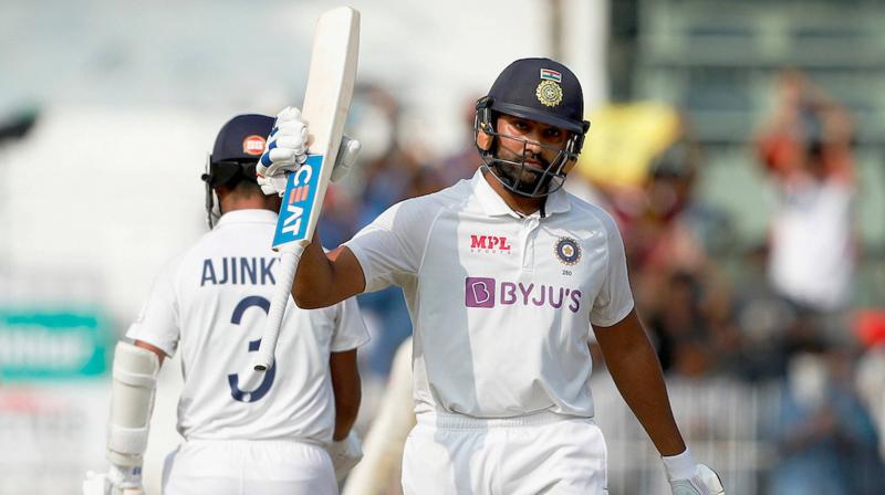 Rohit Sharma raises his bat after he scored 150 runs during the 1st day of second cricket test match between India and England, at M.A. Chidambaram Stadium, in Chennai on Feb. 13, 2021. (BCCI/PTI)