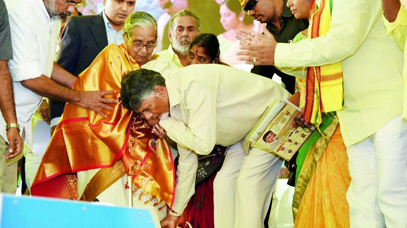 Chief Minister N. Chandrababu Naidu takes blessings from an elderly woman during Janmabhoomi programme at JNTUK in Kakinada on Friday. (DC) Chief Minister N. Chandrababu Naidu takes blessings from an elderly woman during Janmabhoomi programme at JNTUK in Kakinada on Friday. (DC)