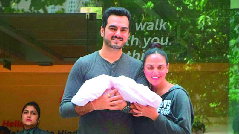 Esha Deol and her husband were photographed exiting the hospital with gleaming smiles. Esha Deol and her husband were photographed exiting the hospital with gleaming smiles.