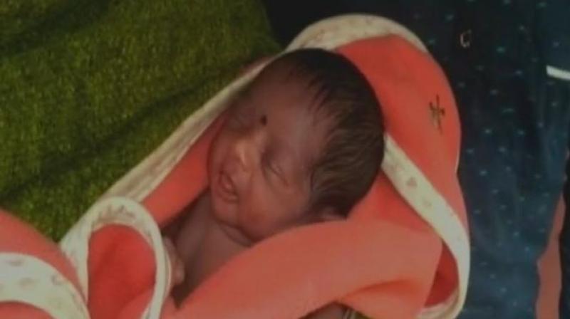 Enthusiastic villagers are thronging in large numbers to see the new born named GST (Photo: Twitter | ANI) Enthusiastic villagers are thronging in large numbers to see the new born named GST (Photo: Twitter | ANI)