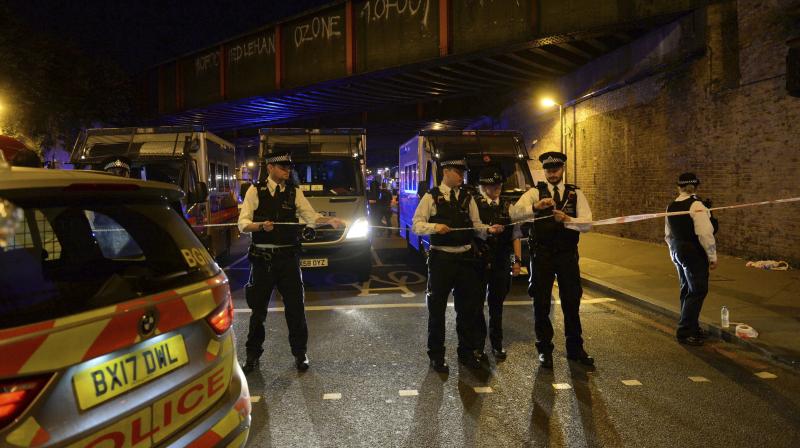 Police officers man a cordon at Finsbury Park where a vehicle struck pedestrians in London Monday. (Photo: AP) Police officers man a cordon at Finsbury Park where a vehicle struck pedestrians in London Monday. (Photo: AP)