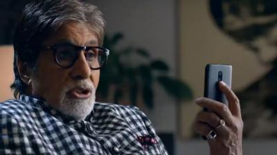 An instance form the OnePlus 6T teaser ad where Amitach is hiding something on the rear of the phone.