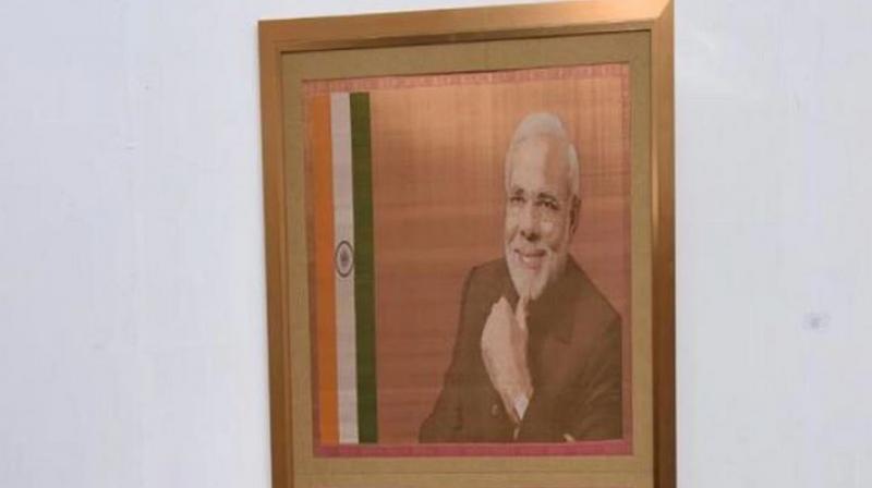 One of the attractions of the auction is a portrait of PM Narendra Modi, at a base price of Rs 2.5 lakh, done on silk. (Photo courtesy: pmmementos.gov.in) One of the attractions of the auction is a portrait of PM Narendra Modi, at a base price of Rs 2.5 lakh, done on silk. (Photo courtesy: pmmementos.gov.in)