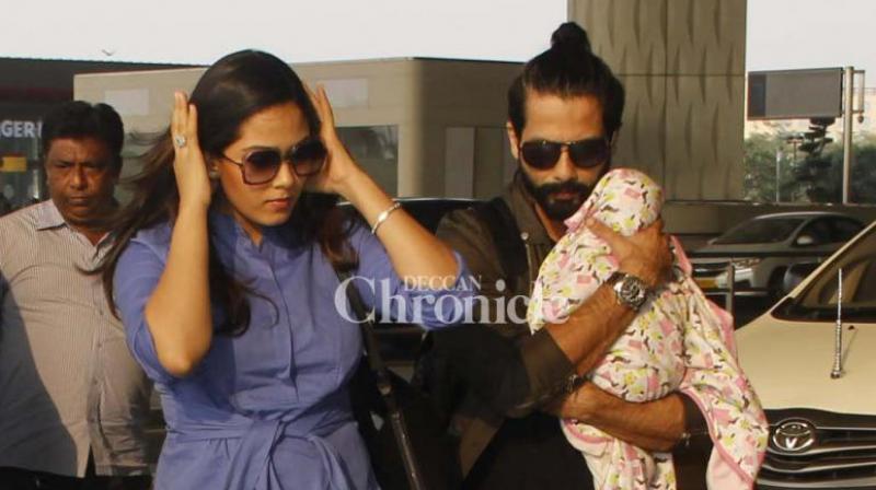 Mira Rajput, Shahid Kapoor and their Misha at the Mumbai airport. Mira Rajput, Shahid Kapoor and their Misha at the Mumbai airport.