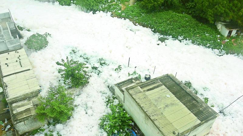 Froth from the Dharaninagar nala flows into the nearby houses following heavy rains that lashed the city on Friday night. (Photo: R. Pavan) Froth from the Dharaninagar nala flows into the nearby houses following heavy rains that lashed the city on Friday night. (Photo: R. Pavan)