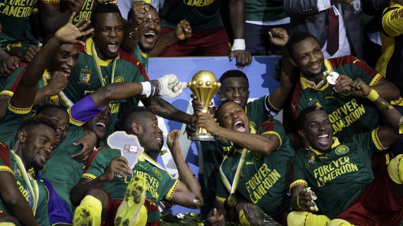 Cameroon players celebrate with the trophy after winning the African Cup of Nations final. (Photo: AP) Cameroon players celebrate with the trophy after winning the African Cup of Nations final. (Photo: AP)