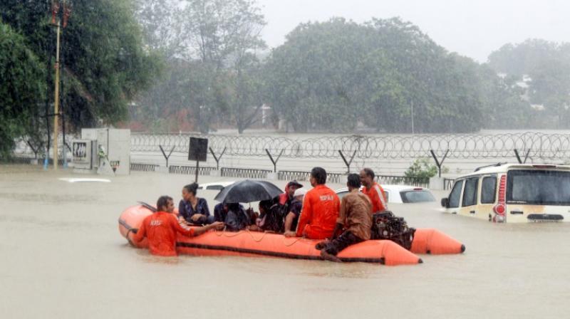 About 5,000 people were evacuated from their homes as water from the overflowing crocodile-infested Vishwamitri River spread through the city of 1.2 million people. (Photo: AFP) About 5,000 people were evacuated from their homes as water from the overflowing crocodile-infested Vishwamitri River spread through the city of 1.2 million people. (Photo: AFP)