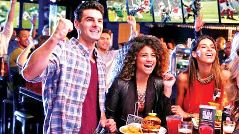 Football fans enjoying the live telecast of the World Cup 2018 in a pub. Football fans enjoying the live telecast of the World Cup 2018 in a pub.