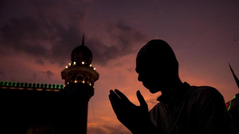 A man offer prayers before breaking his fast. (Photo: AP) A man offer prayers before breaking his fast. (Photo: AP)
