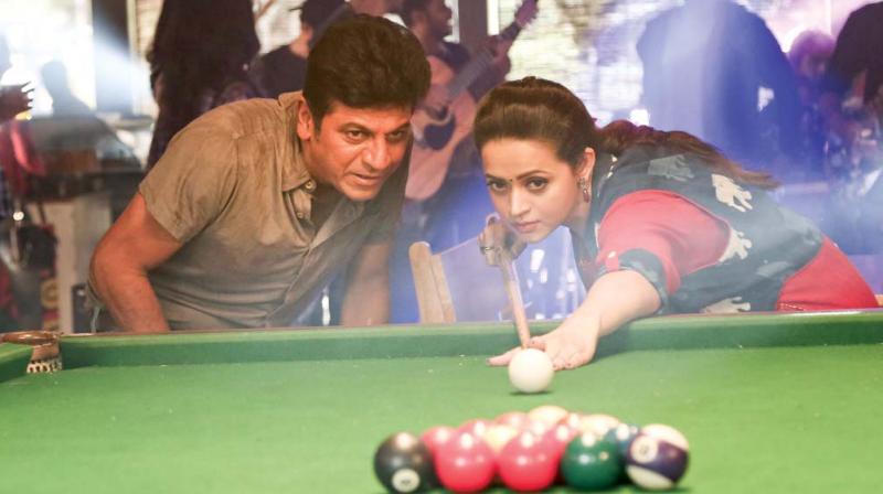Shivarajkumar in a still from Tagaru Shivarajkumar in a still from Tagaru