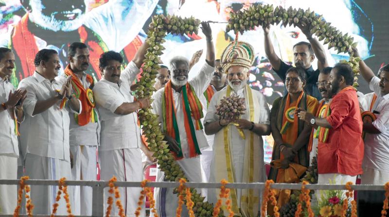 Prime Minister Narendra Modi being garlanded by BJP leaders at Central Stadium in Thiruvananthapuram where he address an election rally on Thursday. NDA candidates in Thiruvananthapuram and Attingal, Kummanam Rajasekharan and Sobha Surendran, BJP state president P. S. Sreedharan Pillai, BJP TVM president S. Suresh, and BJP state general secretary M.T. Ramesh are seen.—A.V. MUZAFAR Prime Minister Narendra Modi being garlanded by BJP leaders at Central Stadium in Thiruvananthapuram where he address an election rally on Thursday. NDA candidates in Thiruvananthapuram and Attingal, Kummanam Rajasekharan and Sobha Surendran, BJP state president P. S. Sreedharan Pillai, BJP TVM president S. Suresh, and BJP state general secretary M.T. Ramesh are seen.—A.V. MUZAFAR