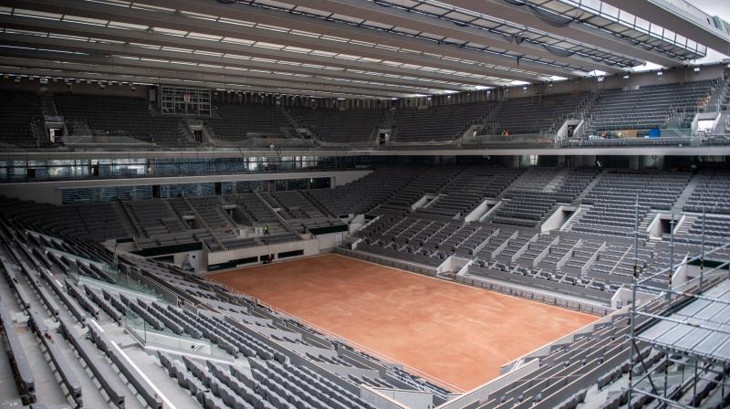 File photo of construction work of the newly built roof of the Philippe Chatrier center court is at Roland Garros stadium in Paris. AP File Photo File photo of construction work of the newly built roof of the Philippe Chatrier center court is at Roland Garros stadium in Paris. AP File Photo