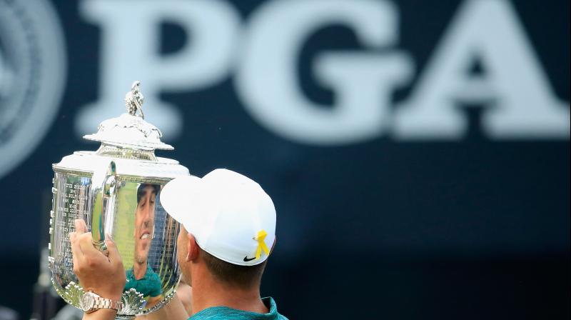 File photo of Brooks Koepka of the United States celebrating with the Wanamaker Trophy after winning the 2018 PGA Championship in St Louis, Missouri, in 2018. AFP Photo