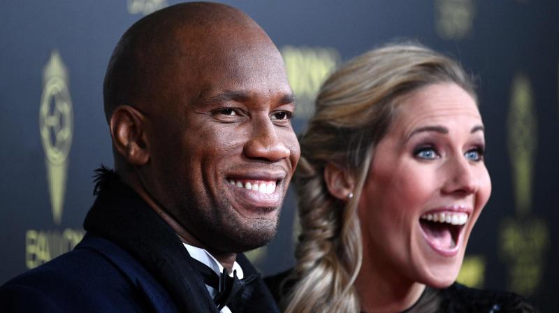 Former Ivorian forward Didier Drogba (L) and French English TV host Sandy Heribert arrive to attend the Ballon d'Or France Football 2019 ceremony at the Chatelet Theatre in Paris on December 2, 2019. AFP Photo Former Ivorian forward Didier Drogba (L) and French English TV host Sandy Heribert arrive to attend the Ballon d'Or France Football 2019 ceremony at the Chatelet Theatre in Paris on December 2, 2019. AFP Photo