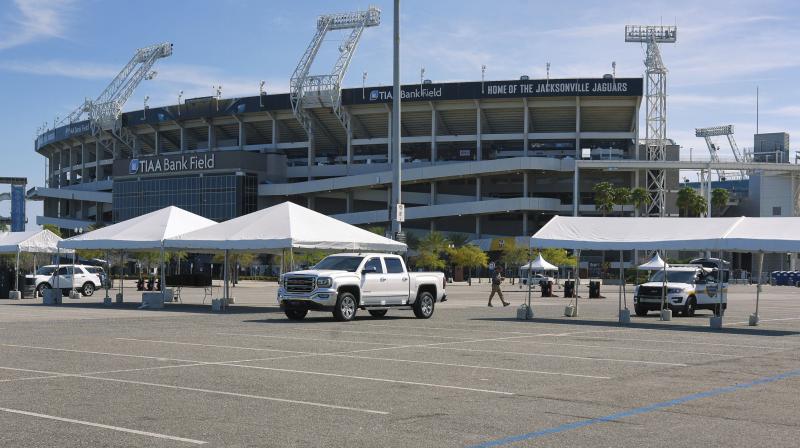 Drive-in test centres outside TIAA Bank Field in Jacksonville, Florida. AP Photo Drive-in test centres outside TIAA Bank Field in Jacksonville, Florida. AP Photo