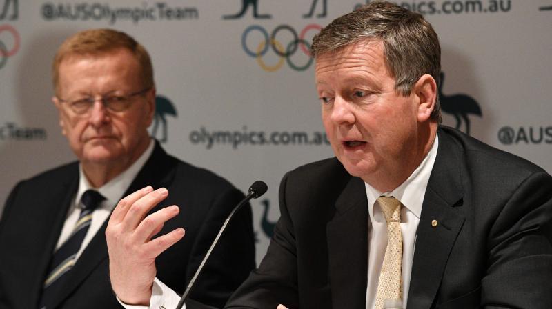Australian Olympic Committee (AOC) chief executive officer Matt Carroll (R) speaks as AOC president John Coates looks on. AFP Photo
