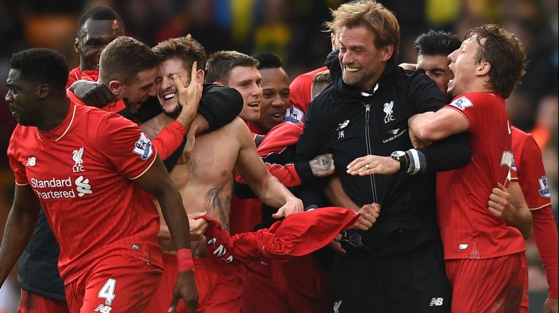 ONE WITH PLAYERS: Liverpool manager Jurgen Klop celebrates Adam Lallanas (third left) goal with other players in the English Premier League match against Norwich City at Carrow Road, Norwich, England, on Jan. 23. AP Photo