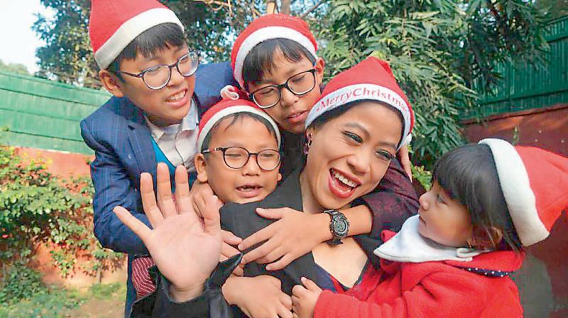 Mary Kom with her children during last Christmas. DC File Photo