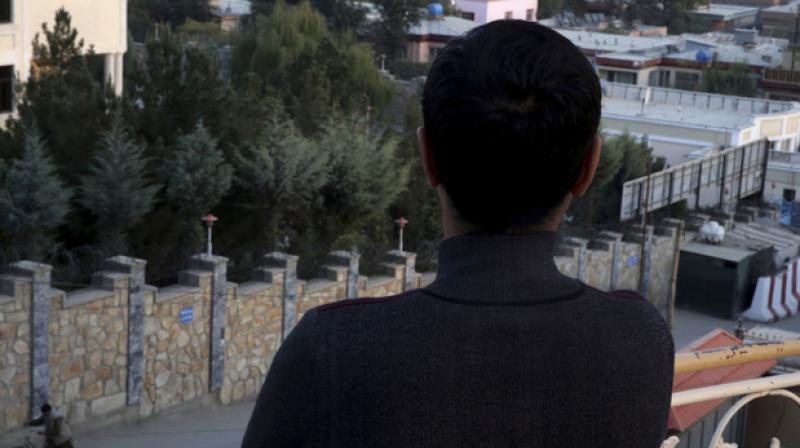 Rameen, a young gay Afghan, poses with his back to the camera in Kabul. (Photo: AP) Rameen, a young gay Afghan, poses with his back to the camera in Kabul. (Photo: AP)