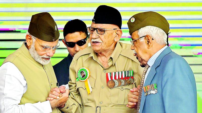 Prime Minister Narendra Modi with INA veteran Lalti Ram during a flag hoisting ceremony to mark the 75th anniversary of the Azad Hind government, at Red Fort in New Delhi, on Sunday. (Photo:PTI) Prime Minister Narendra Modi with INA veteran Lalti Ram during a flag hoisting ceremony to mark the 75th anniversary of the Azad Hind government, at Red Fort in New Delhi, on Sunday. (Photo:PTI)
