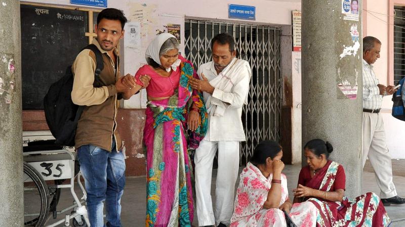 Patients wait outside the OPD at GMC hospital as resident doctors were on a strike in Nagpur. (Photo: PTI) Patients wait outside the OPD at GMC hospital as resident doctors were on a strike in Nagpur. (Photo: PTI)