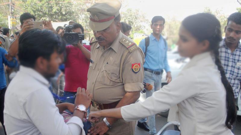 Anti-Romeo squad of police hauls up a youth in Lucknow on Wednesday. "Anti-Romeo squads" ordered by new Chief Minister of Uttar Pradesh, Yogi Adityanath have started work across the state. (Photo: PTI) Anti-Romeo squad of police hauls up a youth in Lucknow on Wednesday. "Anti-Romeo squads" ordered by new Chief Minister of Uttar Pradesh, Yogi Adityanath have started work across the state. (Photo: PTI)