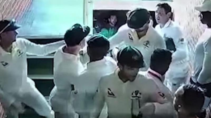CCTV footage showed Australian vice-captain David Warner apparently turning on South African Quinton de Kock as the players walked up a narrow staircase leading to the dressing rooms during the tea break on Sunday. (Photo: Screengrab) CCTV footage showed Australian vice-captain David Warner apparently turning on South African Quinton de Kock as the players walked up a narrow staircase leading to the dressing rooms during the tea break on Sunday. (Photo: Screengrab)
