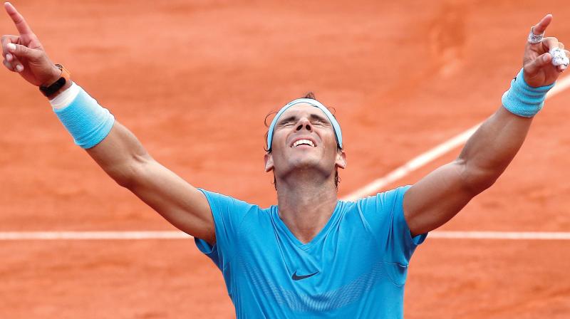 Rafael Nadal of Spain celebrates beating Dominic Thiem of Austria in the men’s final of the French Open tennis tournament at the Roland Garros stadium in Paris on Sunday. Nadal won in straight sets 6-4, 6-3, 6-2. (Photo:AP) Rafael Nadal of Spain celebrates beating Dominic Thiem of Austria in the men’s final of the French Open tennis tournament at the Roland Garros stadium in Paris on Sunday. Nadal won in straight sets 6-4, 6-3, 6-2. (Photo:AP)