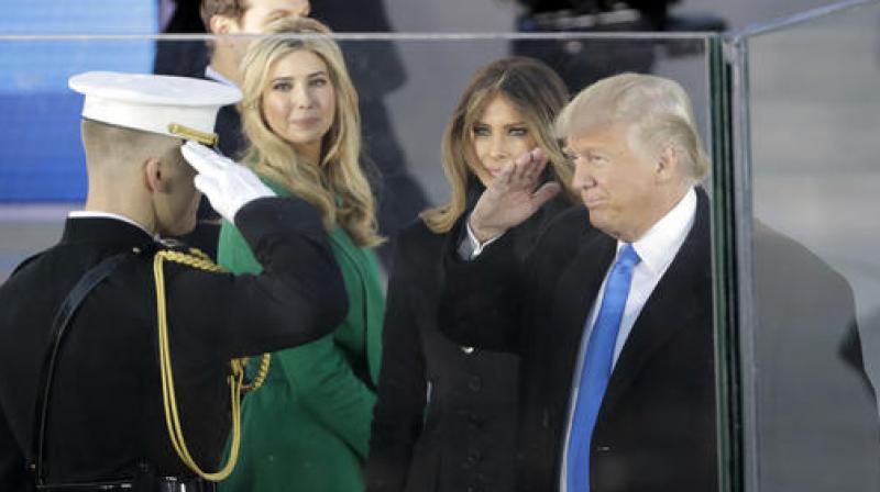 President-elect Donald Trump salutes as he arrives with his wife Melania Trump and daughter Ivanka Trump at a pre-Inaugural "Make America Great Again! Welcome Celebration" at the Lincoln Memorial in Washington. (Photo: AP) President-elect Donald Trump salutes as he arrives with his wife Melania Trump and daughter Ivanka Trump at a pre-Inaugural "Make America Great Again! Welcome Celebration" at the Lincoln Memorial in Washington. (Photo: AP)