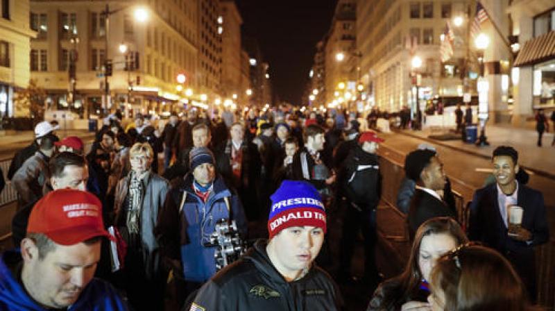 Spectators wait in line to pass through security checkpoints of President-elect Donald Trump's inauguration. (Photo: AP) Spectators wait in line to pass through security checkpoints of President-elect Donald Trump's inauguration. (Photo: AP)